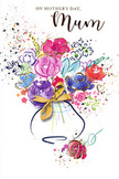 The Mother's Day card features a vibrant, artistic bouquet rendered in fluid watercolour, as if someone has captured the feeling of bringing home fresh flowers from a Dalston florist and poured it onto paper. Deep indigo lines sweep loosely around a cluster of bold cerise and soft pink blooms, their edges gently blurring into pools of colour that suggest open petals without pinning them down. Pale blues, lavenders, and hints of apricot weave between the warmer tones, giving the arrangement a harmonious balance that feels both lively and soothing. Threads of metallic gold highlight certain curves of petals and leaves, adding a subtle sparkle reminiscent of sunlight catching on dewy blossoms in a local garden off Kingsland Road. The flowers gather in a simple vase, its presence suggested by translucent washes of colour, anchored at the base by a neat golden bow that brings to mind the satisfying final tie of a ribbon around a carefully prepared bouquet. Around the main cluster, scattered hearts, flecks, and splashes of paint float across the clean white background, creating the impression of petals or confetti drifting in the air during a family celebration. The entire composition feels like a visual embrace-spontaneous yet intentional, joyful yet deeply affectionate. It captures the warmth, appreciation, and gentle festivity of Mother's Day, making it easy to imagine this card accompanying a hand-delivered arrangement somewhere along Dalston Lane, expressing love where words might feel too small on their own.